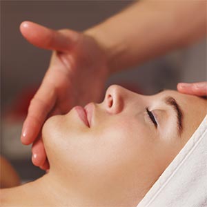 A relaxed woman getting a massage